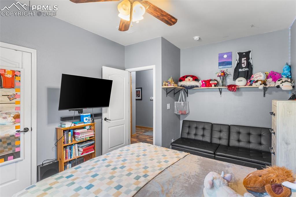 Image 20 of 46: Bedroom with ceiling fan