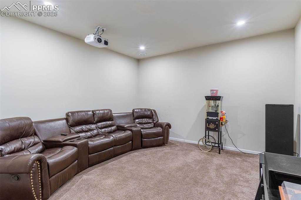 Image 22 of 46: Home theater with carpet and recessed lighting