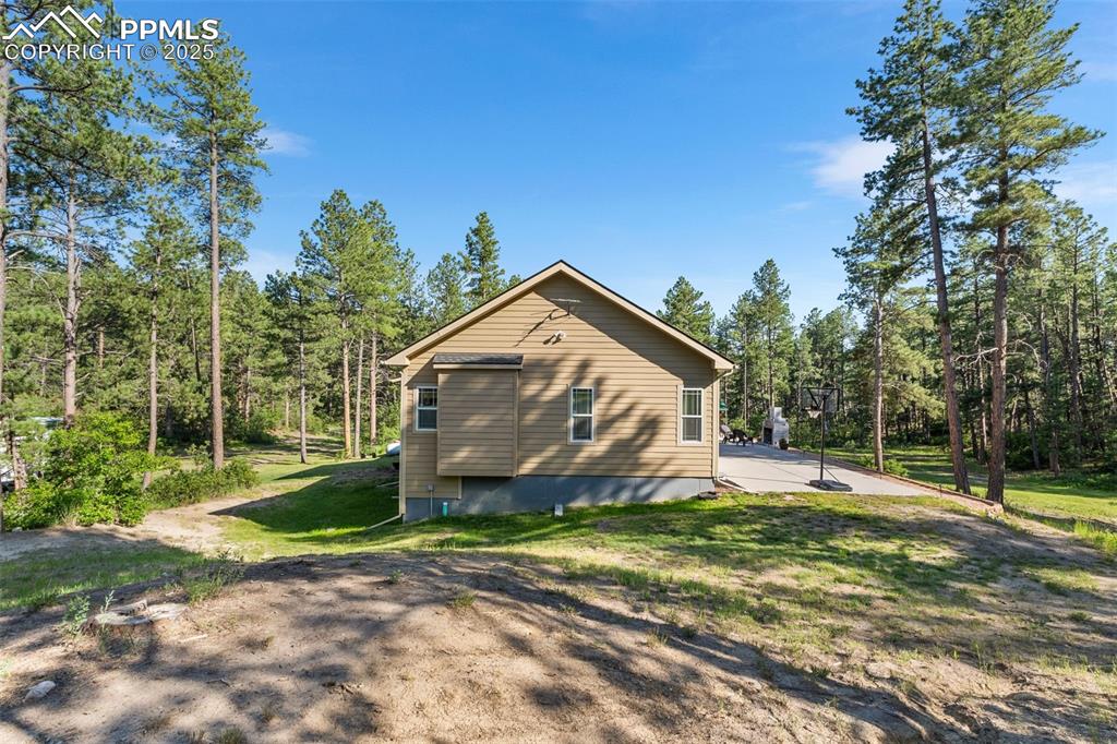 Image 39 of 46: View of property exterior with a lawn