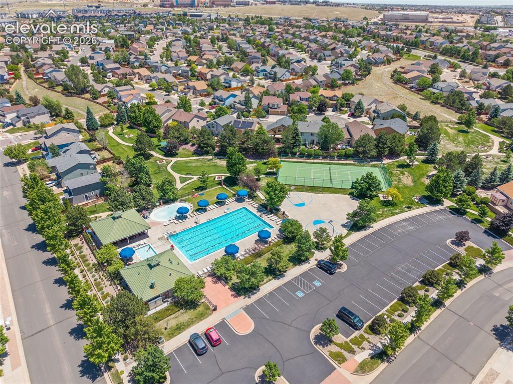Image 46 of 48: Neighborhood pool, pickleball courts, basketball courts, and winding trails