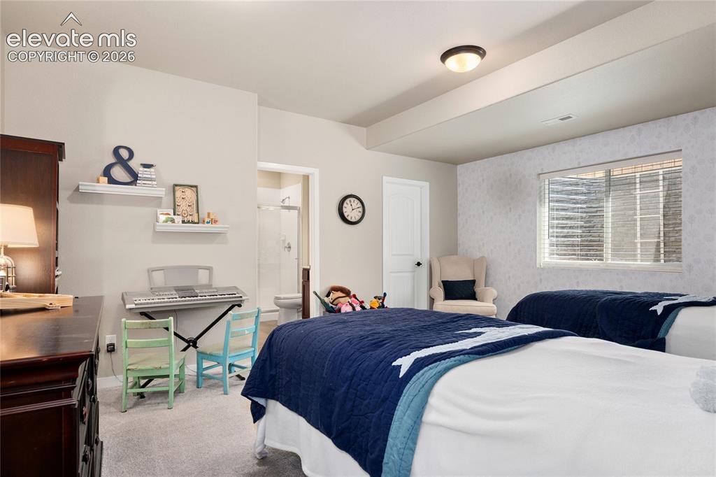 Image 33 of 41: Oversized basement bedroom w/ Ensuite