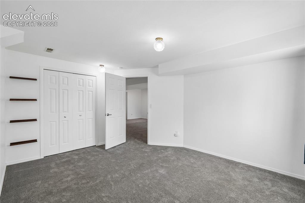 Image 17 of 50: Basement bedroom