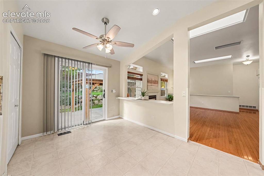 Image 10 of 28: A walk-out to the backyard for easy indoor-outdoor living.
