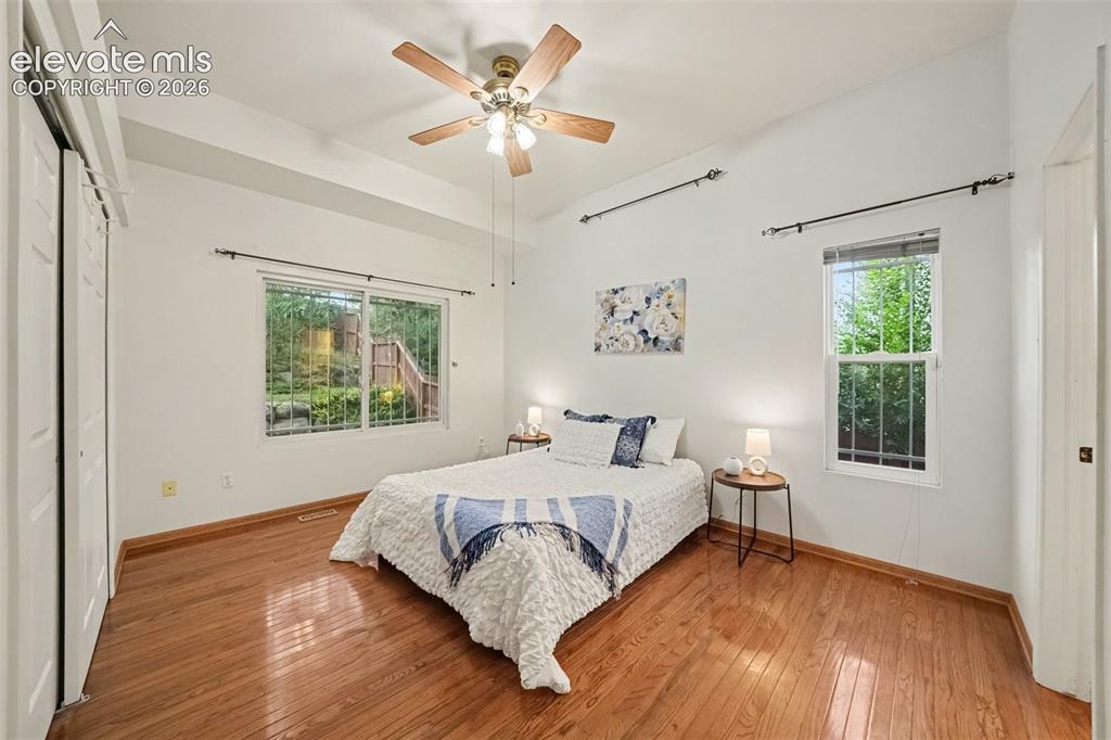 Image 11 of 28: The spacious primary bedroom features an adjoining full bath, creating a co
