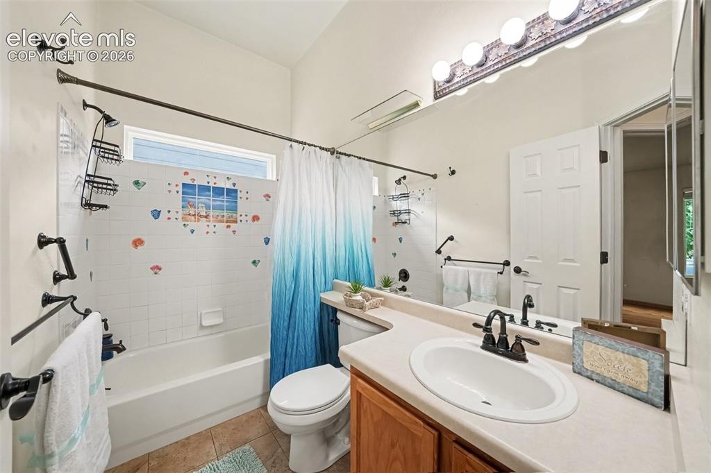 Image 16 of 28: The 2nd main-level bathroom features a clean, functional layout with conven
