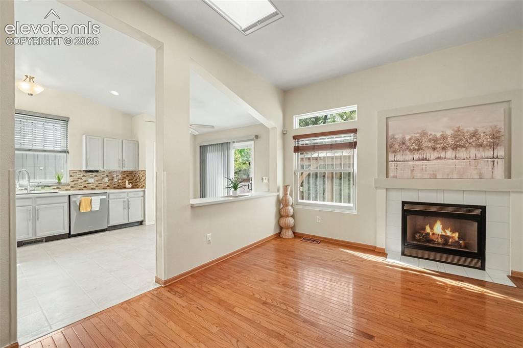 Image 8 of 28: The living room flows seamlessly into the kitchen, creating an inviting ope