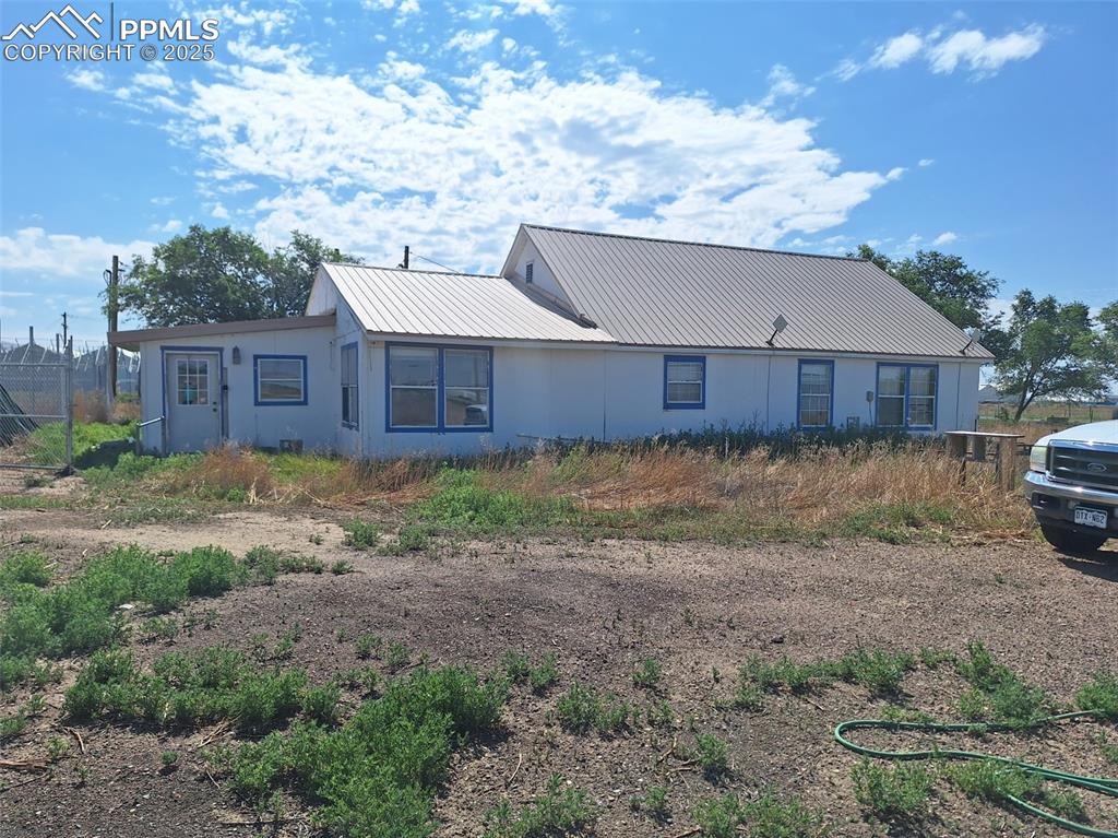 Caption: Back of house with a metal roof