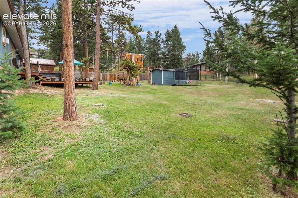 Image 31 of 31: Back Deck and Hot Tub