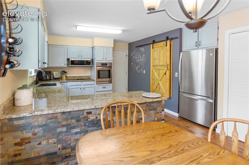 Image 7 of 31: Dining and Kitchen
