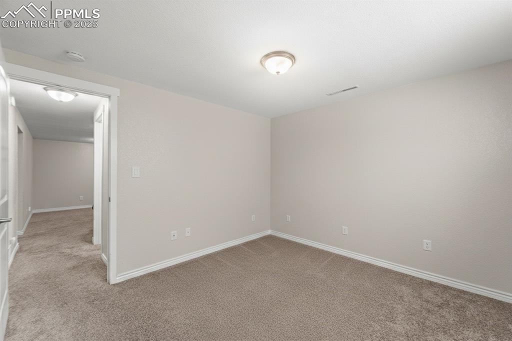 Image 29 of 48: Unfurnished room featuring light colored carpet