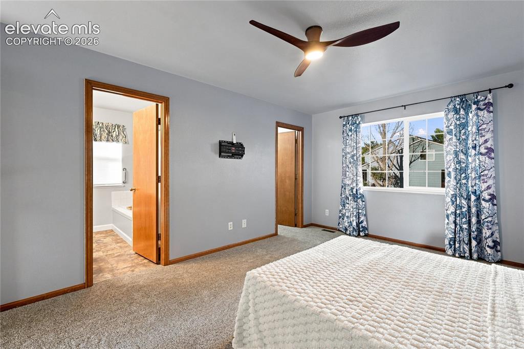 Image 13 of 27: Primary bedroom with 2 walk in closets