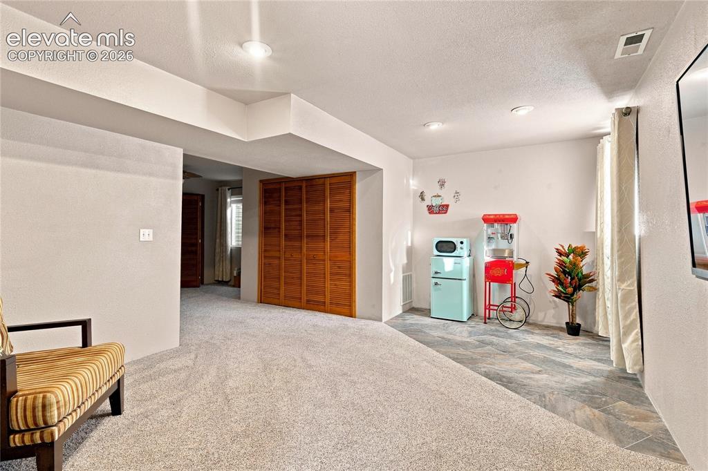 Image 21 of 27: Basement family room