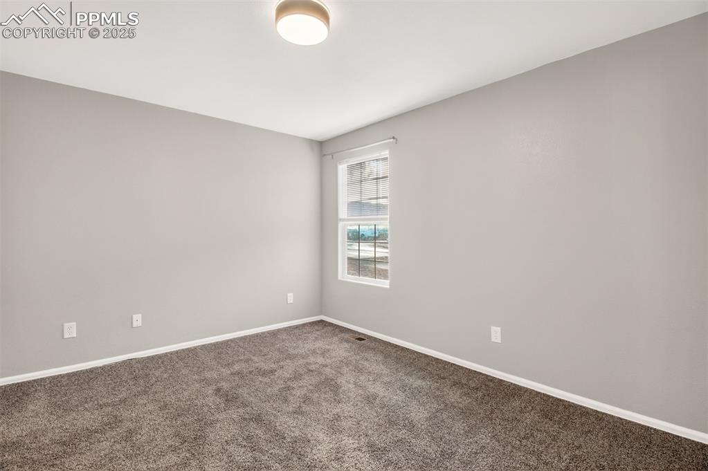 Image 13 of 24: Primary bedroom with new paint/carpet.