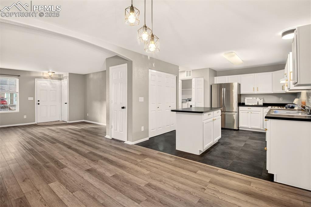 Image 6 of 24: Open concept kitchen and dining area.