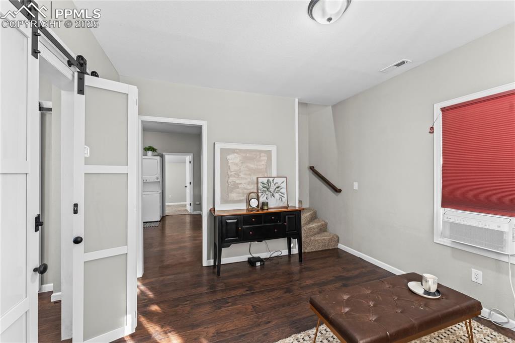 Image 4 of 23: Living room with access to kitchen, dining room and stairs