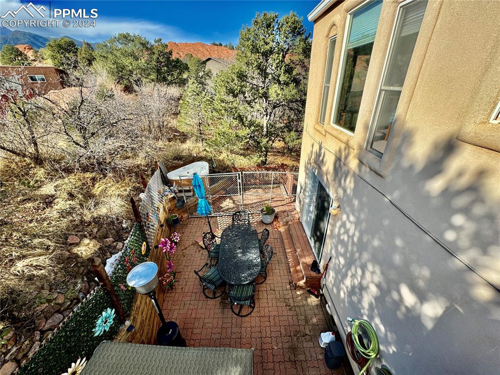 Image 19 of 48: View of patio with a mountain view from Primary Suite Deck