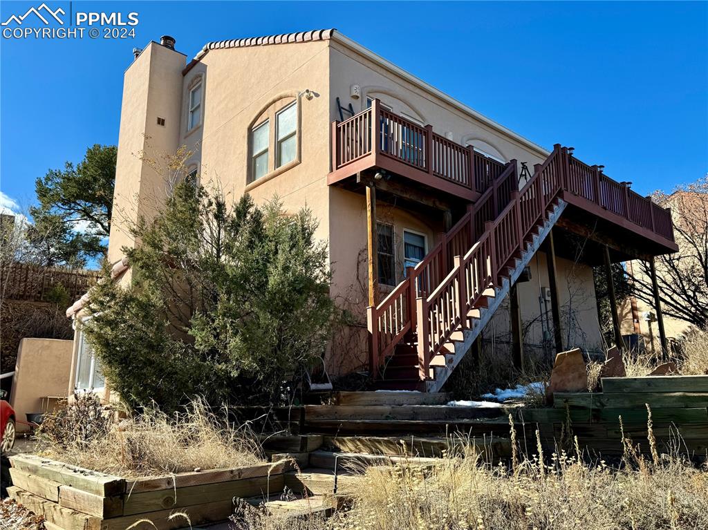 Image 3 of 48: Front of house featuring a balcony