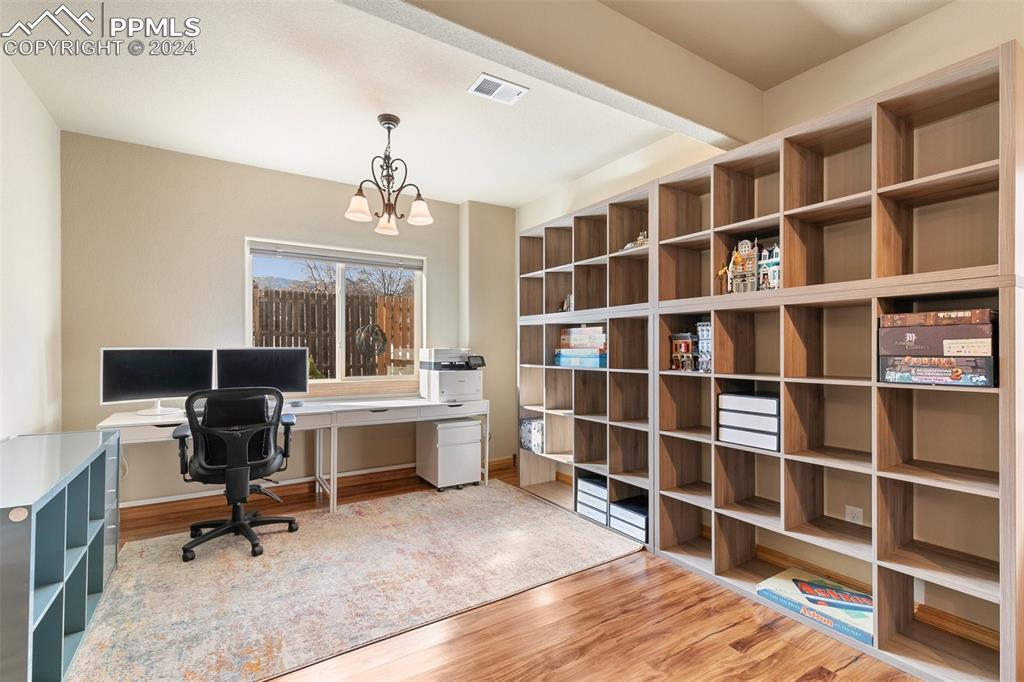 Image 25 of 39: Expansive basement rec room has space for all of your entertaining, hobbies