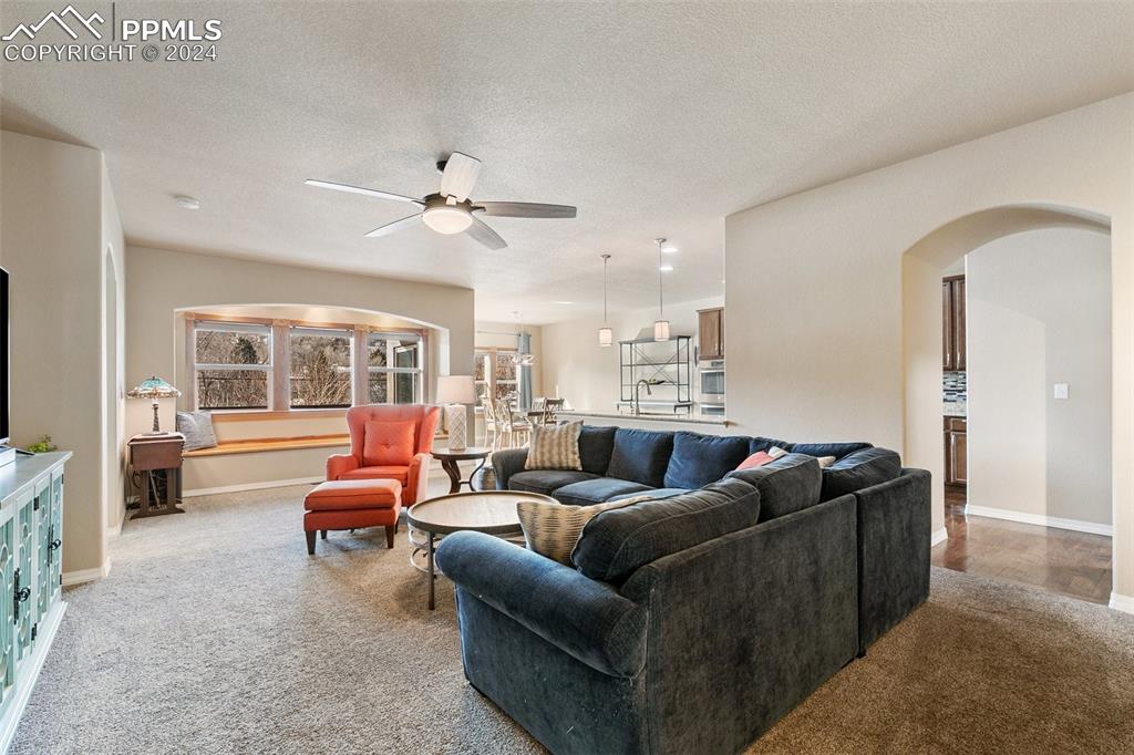 Image 5 of 39: Large living room with window seat.