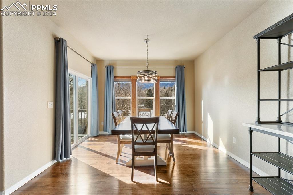 Image 9 of 39: Wood floors, walk-out to composite deck and mountain views.