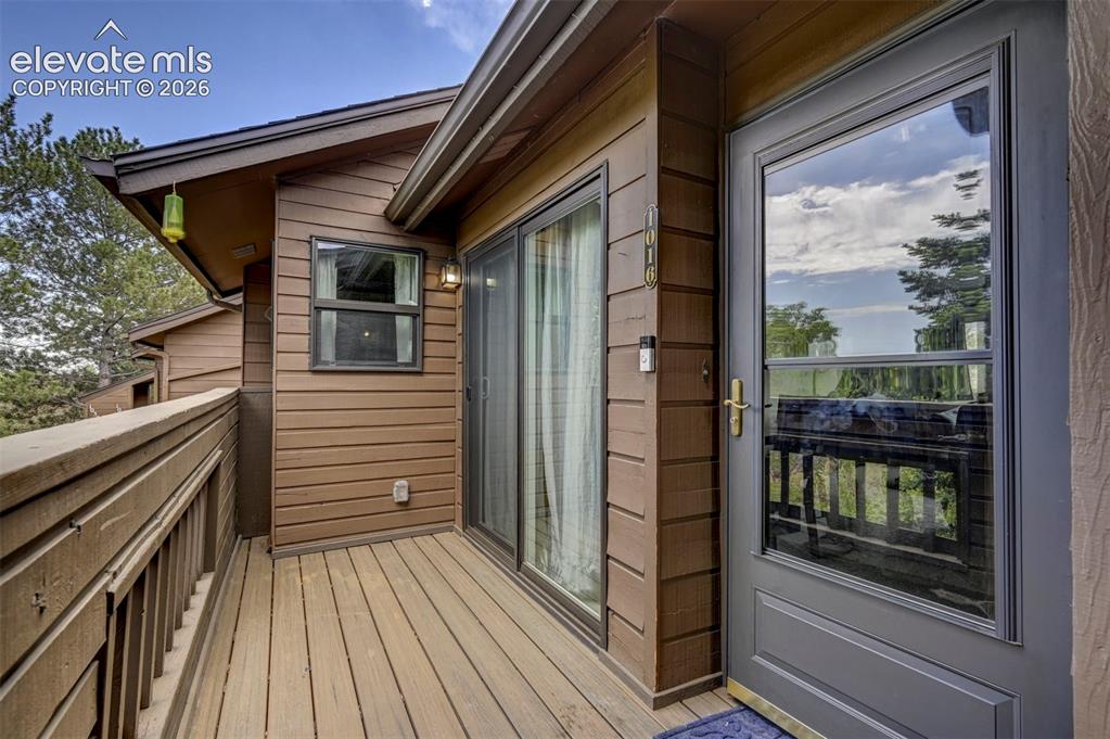 Image 2 of 25: Inviting front entrance opens to Walk-Out Deck. Perfect for relaxing or enj