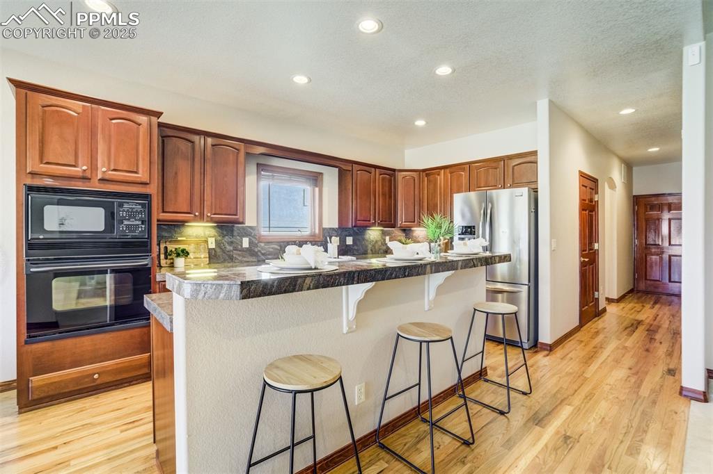 Image 11 of 49: Kitchen island for additional seating.
