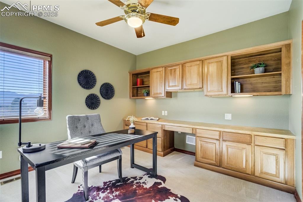 Image 16 of 49: Front office with built-in