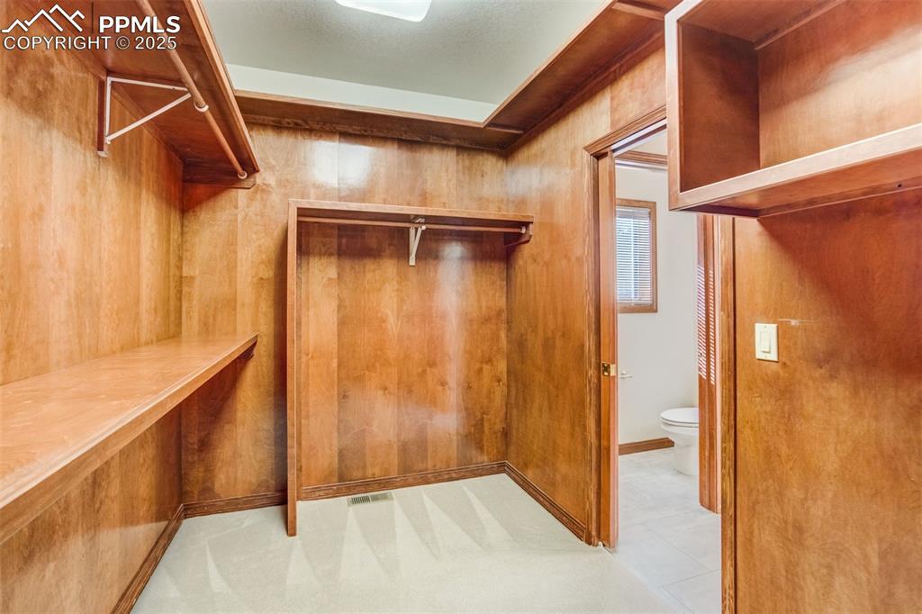 Image 26 of 49: Large walk-in closet.