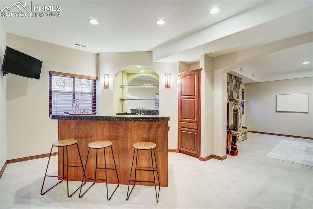 Image 36 of 49: Bar area- perfect spot for hosting family & friends.