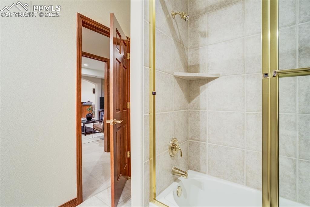 Image 40 of 49: Tub/ shower in the basement bathroom.