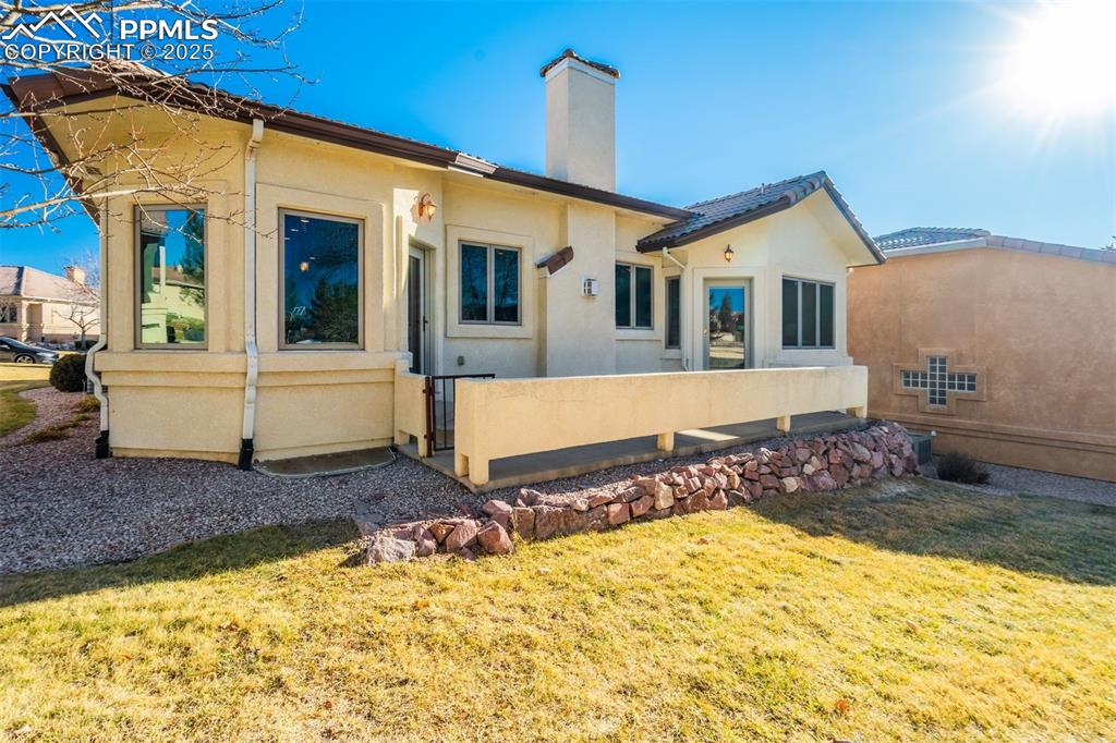Image 44 of 49: Great backyard patio with landscaping you don