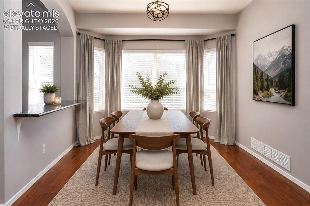 Image 13 of 50: Virtually staged dining room