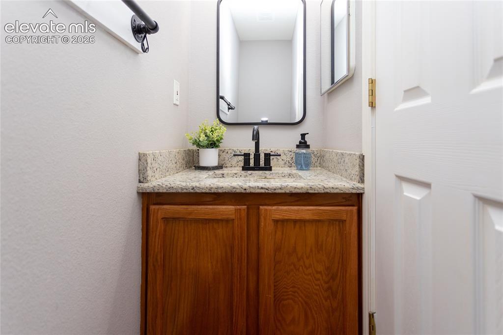 Image 20 of 50: 1/2 bath near kitchen on main floor