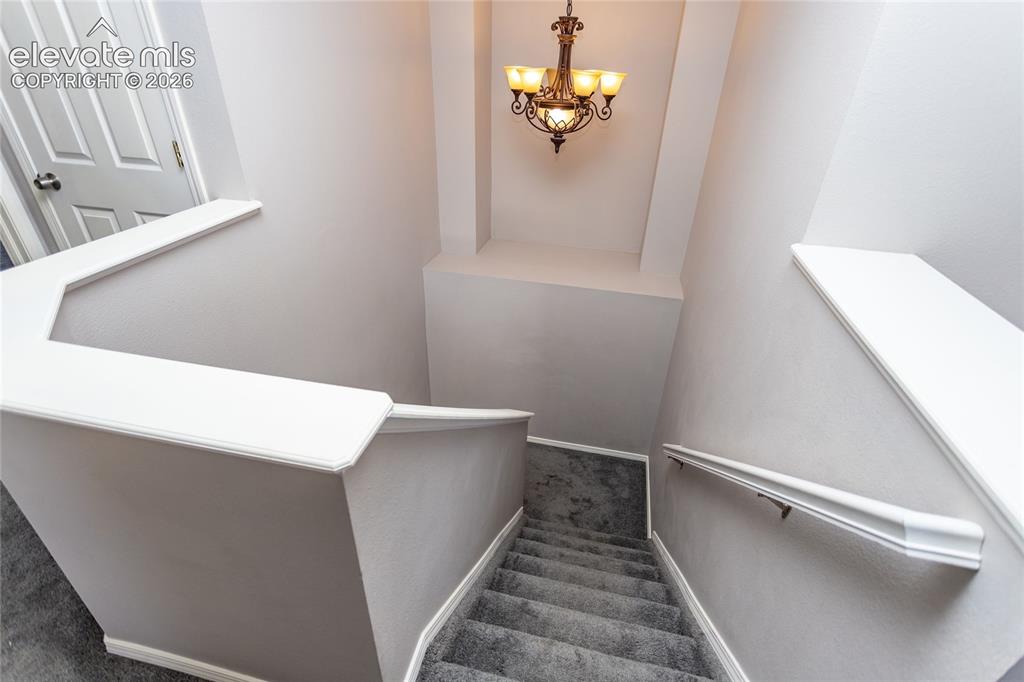 Image 36 of 50: Stairs from upstairs loft area to main floor