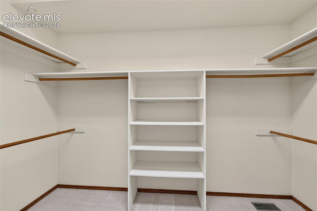 Image 18 of 50: Primary Walk-In Closet
