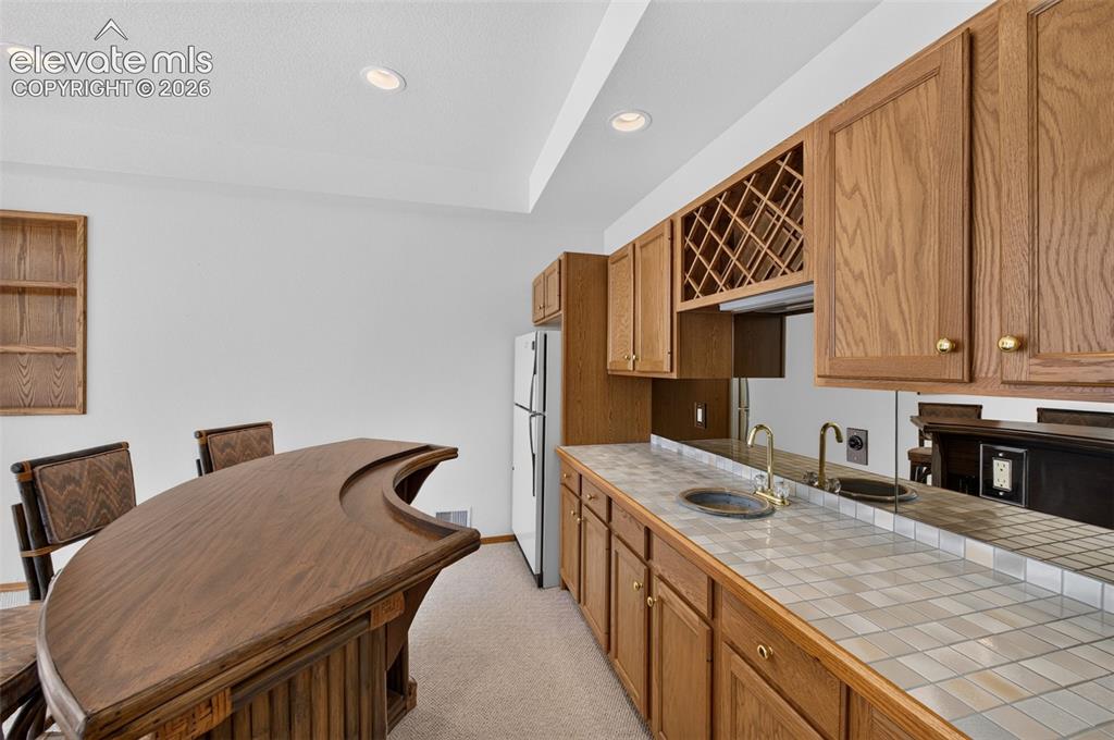 Image 23 of 50: Kitchen/Bar and Wet Bar Basement