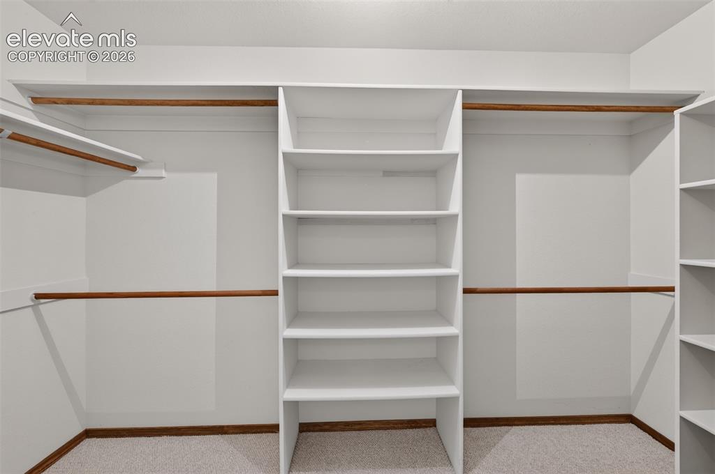 Image 28 of 50: Bedroom/Office Walk-In Closet