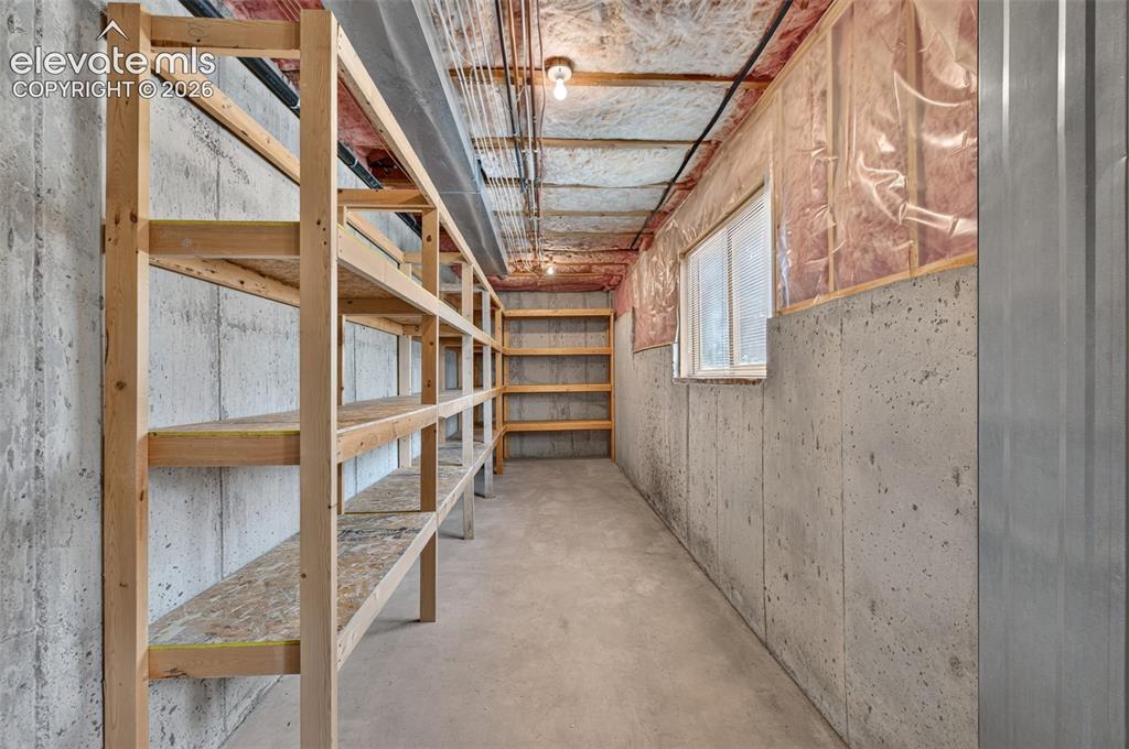 Image 30 of 50: Huge Storage with lots of shelving in Basement
