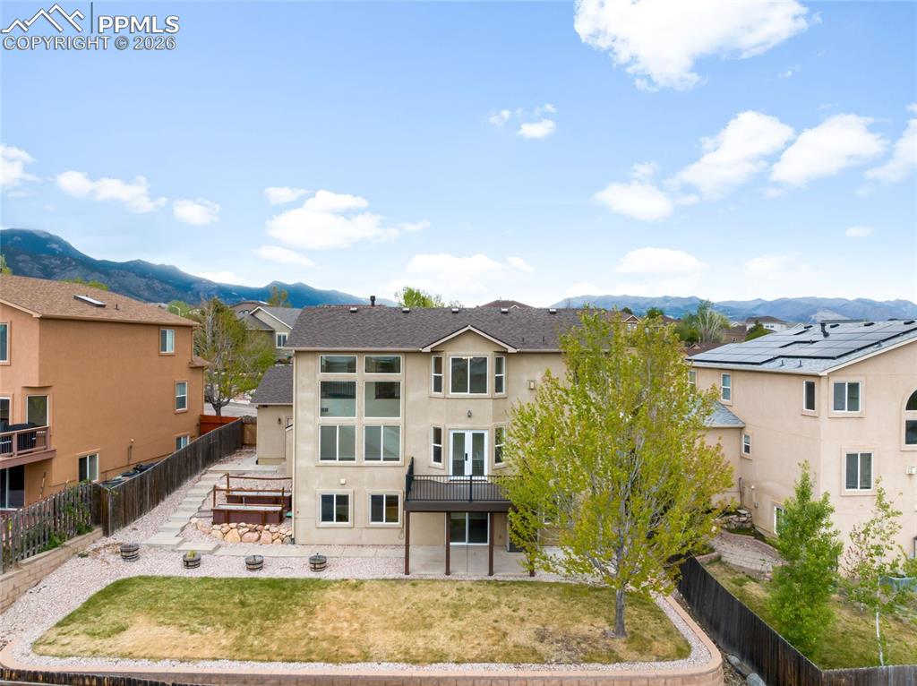 Image 35 of 35: Exterior featuring a multi-story design with extensive windows, a second-st