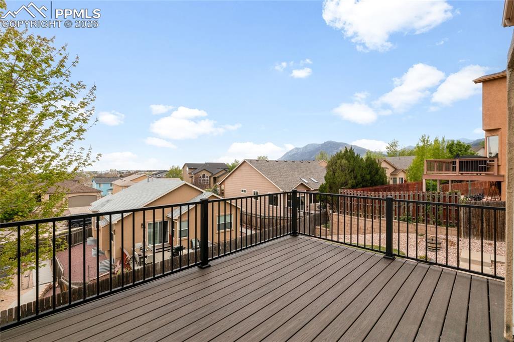 Image 9 of 35: Updated composite decking with views of Cheyenne Mountain.