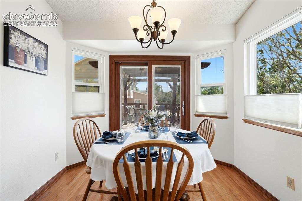 Image 10 of 32: Walk out dining room that leads to pergola