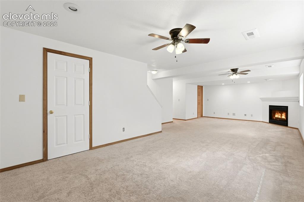 Image 20 of 32: Large finished basement living area