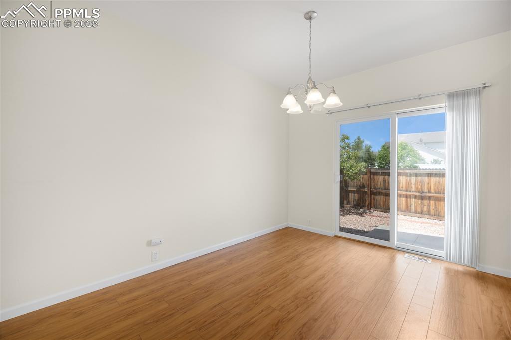 Image 12 of 25: Dining area w/ walk-out to patio