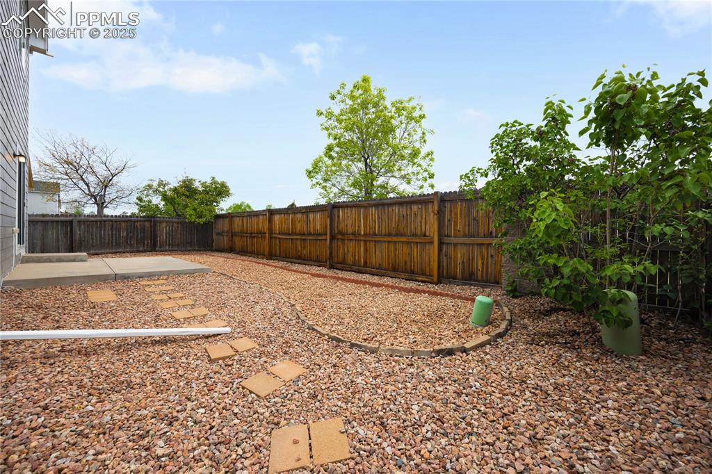 Image 22 of 25: Xeriscaped yard for easy maintenance
