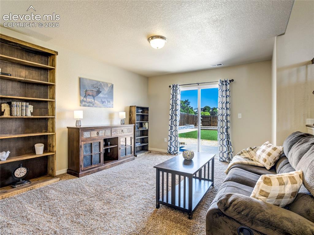 Image 18 of 39: This versatile room could be a home theater or games space