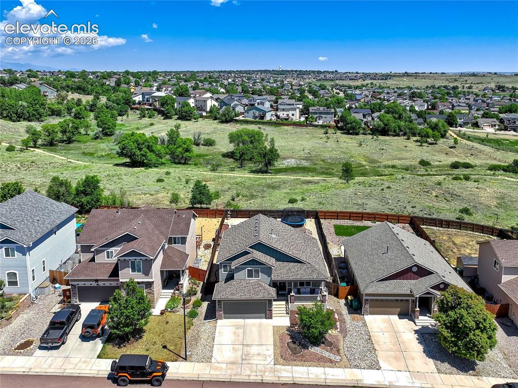 Image 2 of 39: Backs up to Corral Bluffs Open Space & Jimmy Camp Creek Park, a geologicall