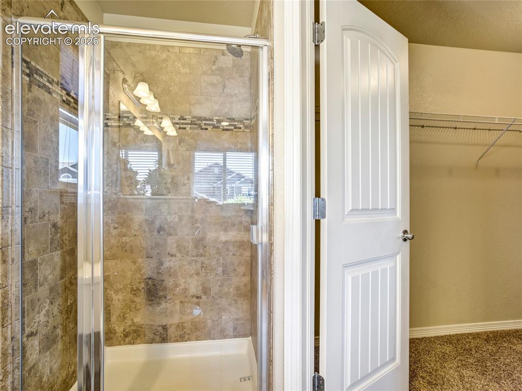 Image 26 of 39: Walk-in shower