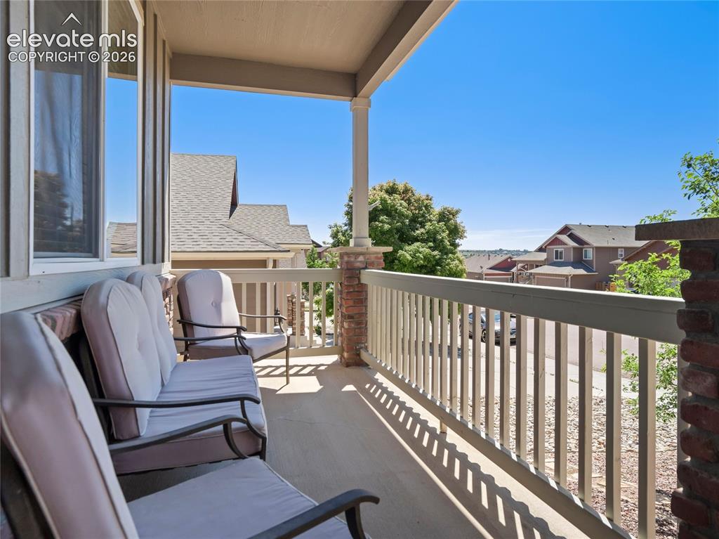 Image 8 of 39: Watch the seasons change from the covered front porch