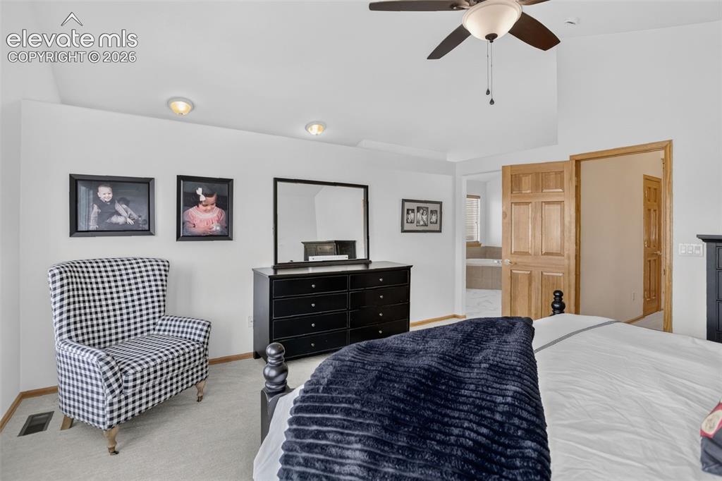 Image 30 of 49: Vaulted ceiling with ceiling fan and recessed lighting
