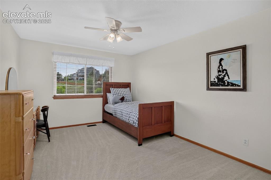 Image 34 of 49: Bedroom featuring light-toned carpeting, a window with blinds, and a ceilin